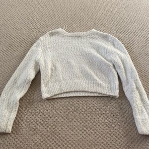 white fuzzy sweater